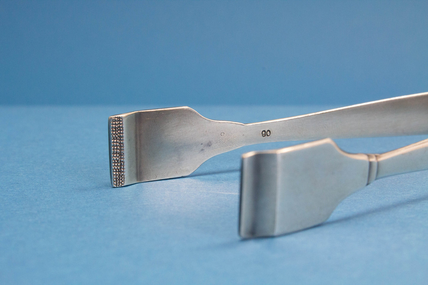 Silver plated sugar tongs with art deco pattern