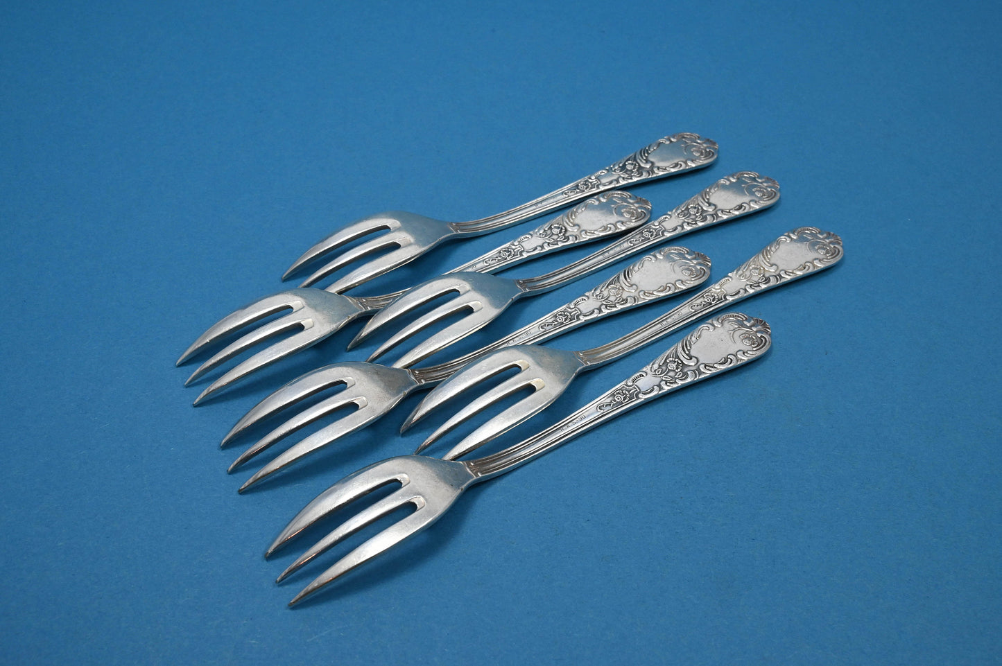 6 versilberte Kuchengabeln, Rokoko