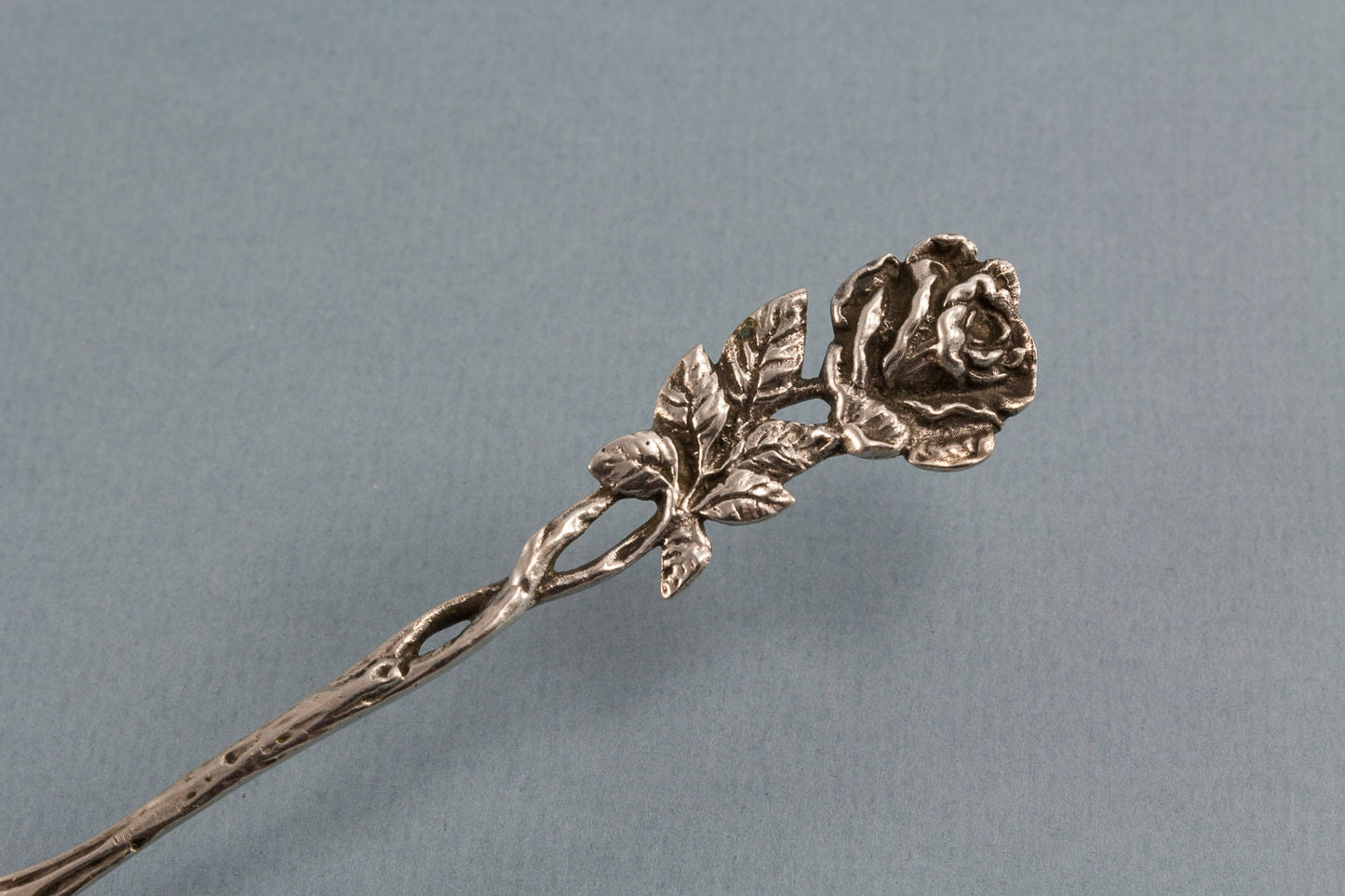 Silver sugar spoon with roses, 835 silver 