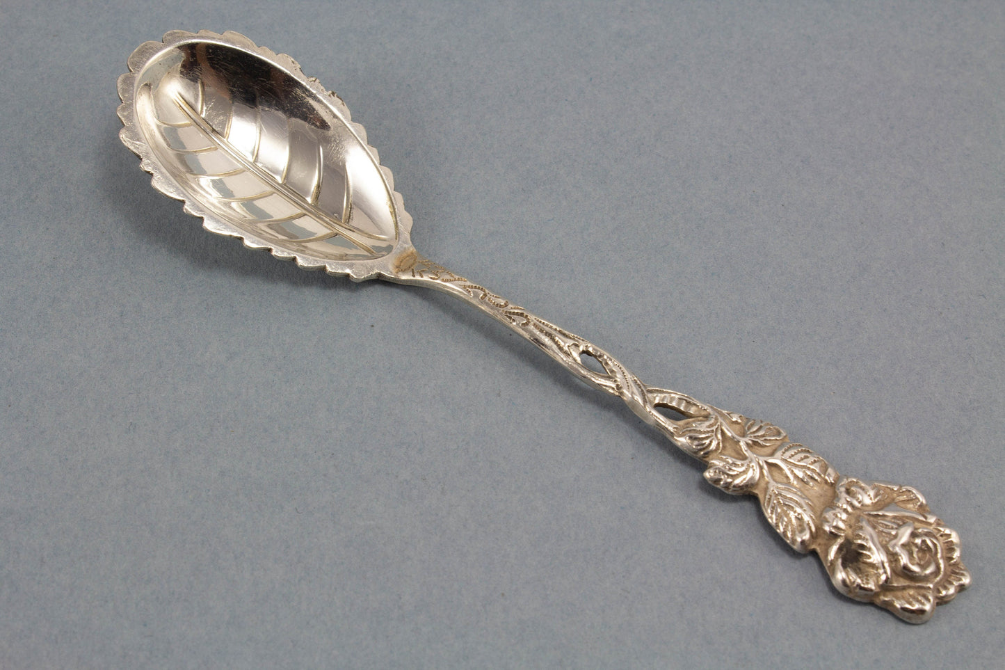 Small sugar spoon with roses, silver plated 