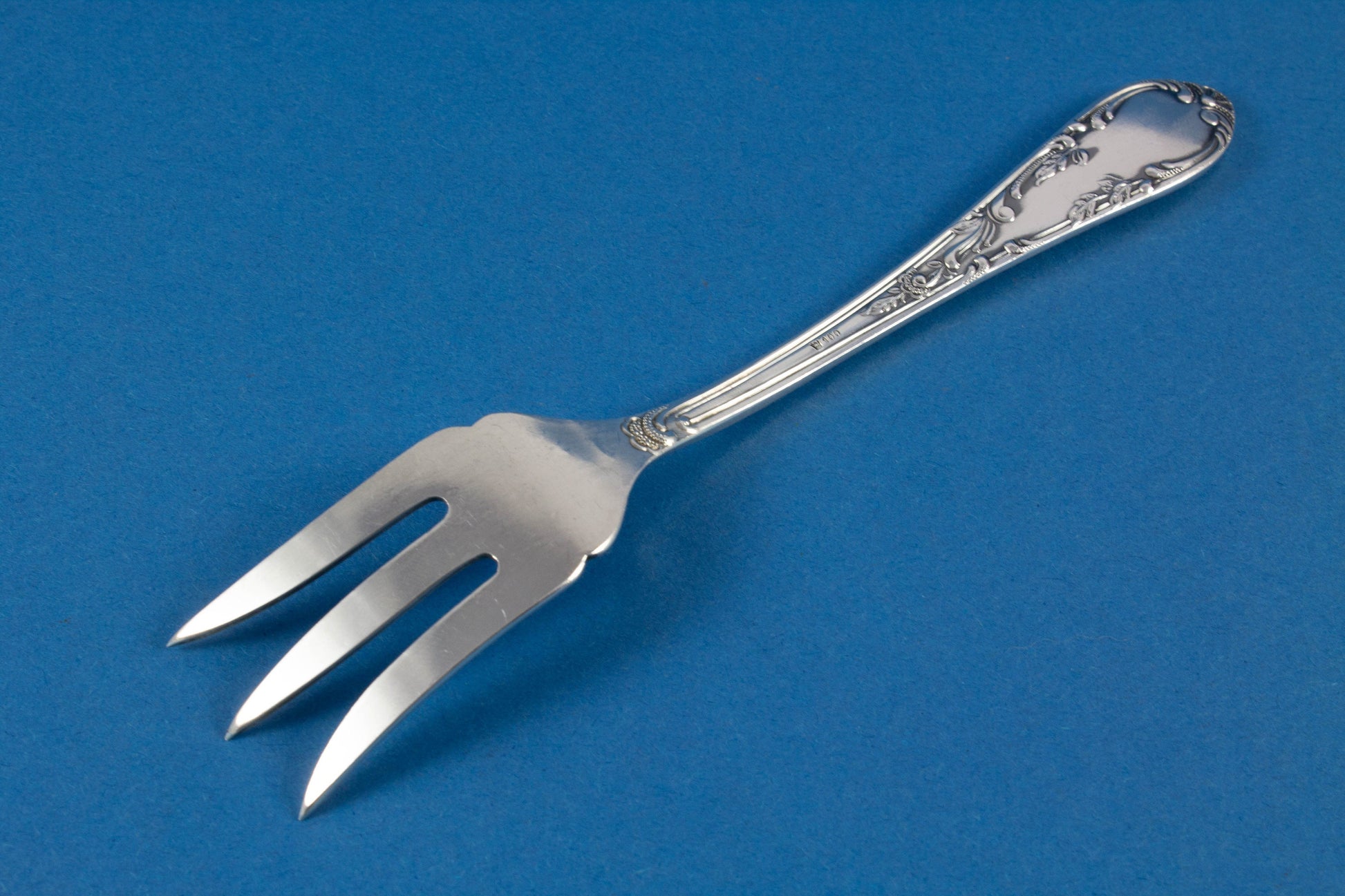 Silver plated bread fork in rococo style