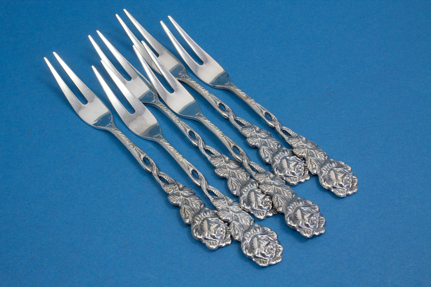 6 cocktail forks, small skewers