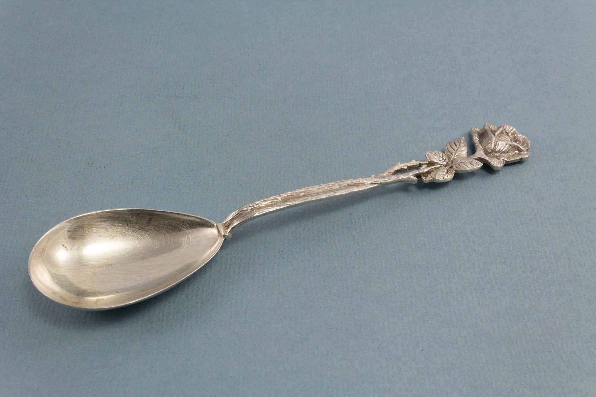 Silver sugar spoon with roses, 800 silver