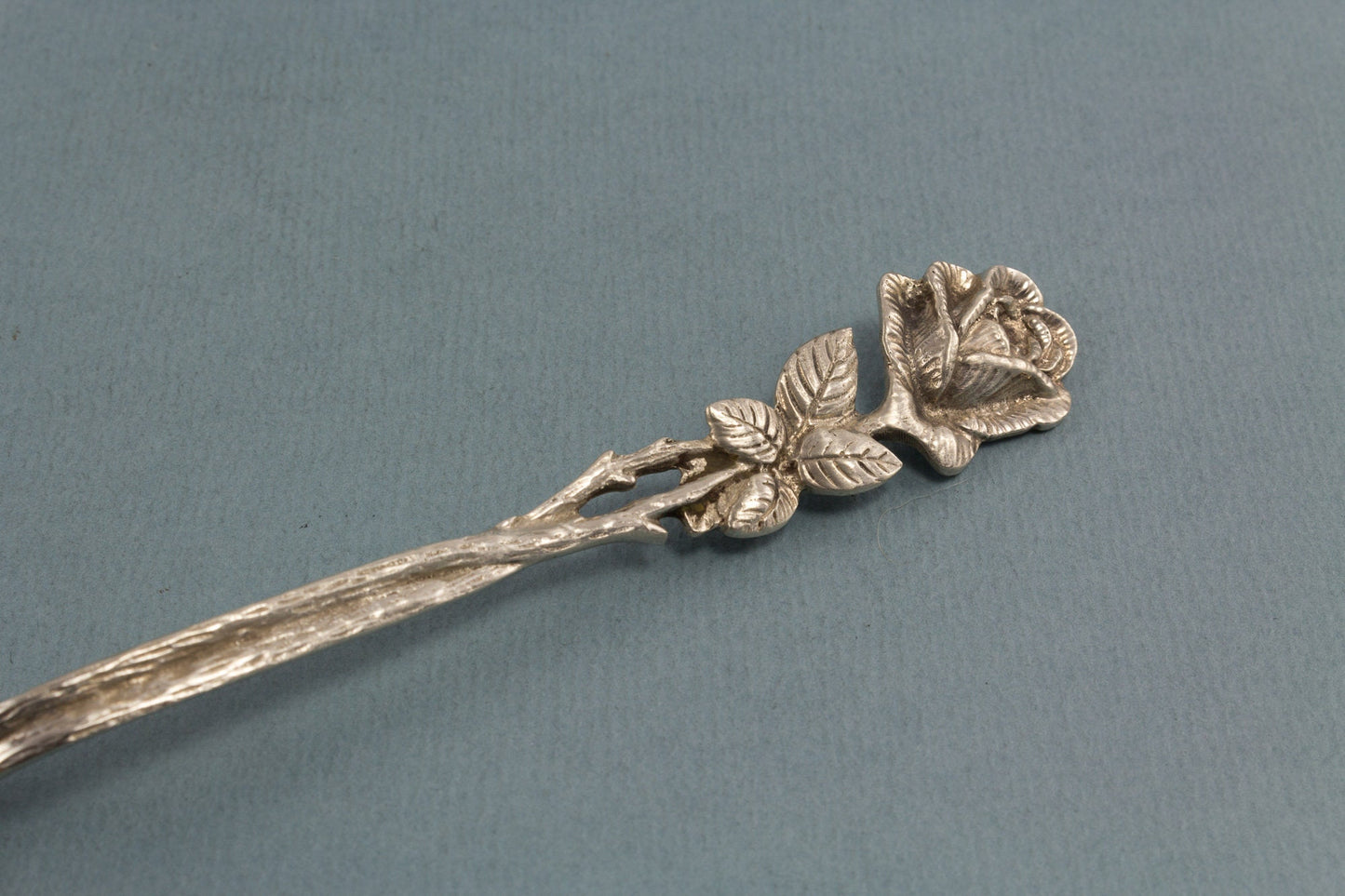 Silver sugar spoon with roses, 800 silver