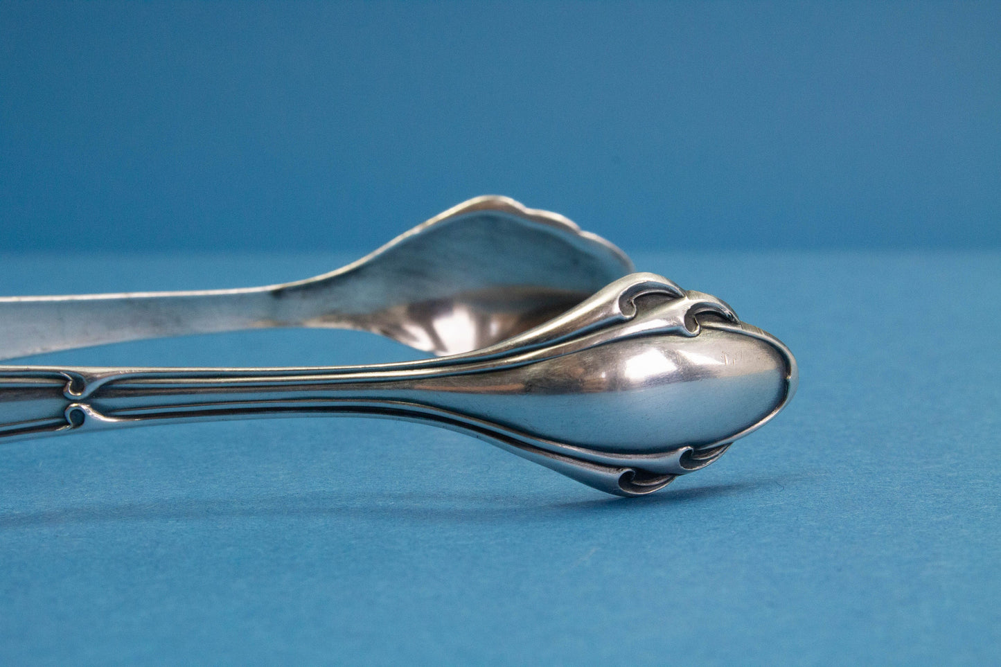 Silver plated sugar tongs with art nouveau pattern