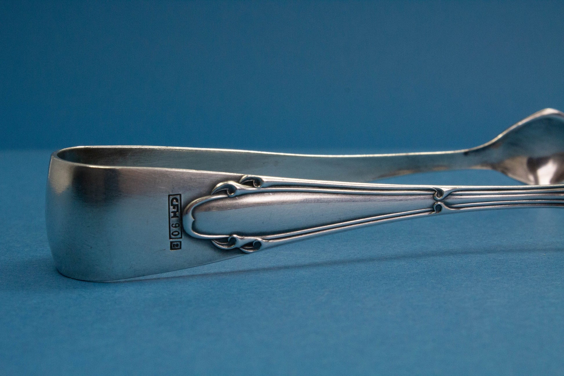 Silver plated sugar tongs with art nouveau pattern