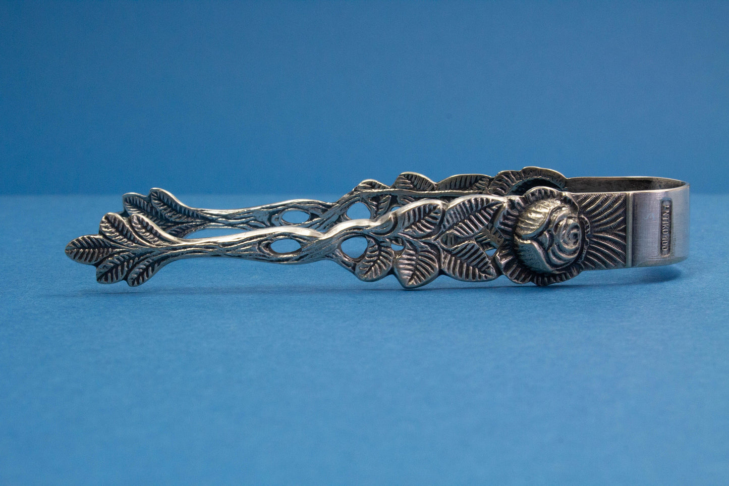 Silver plated sugar tongs with roses