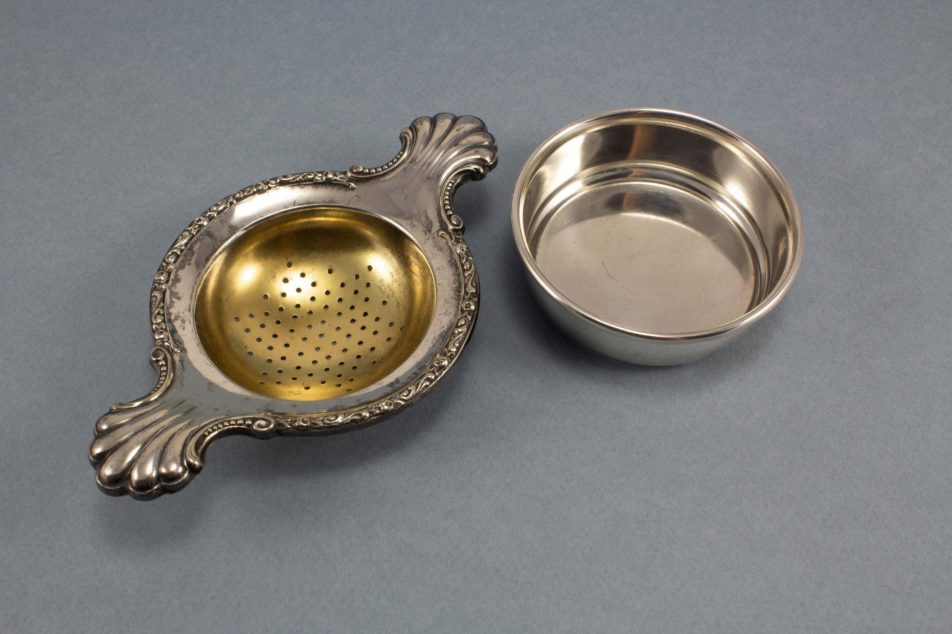 Silver-plated tea strainer with Art Nouveau decorations