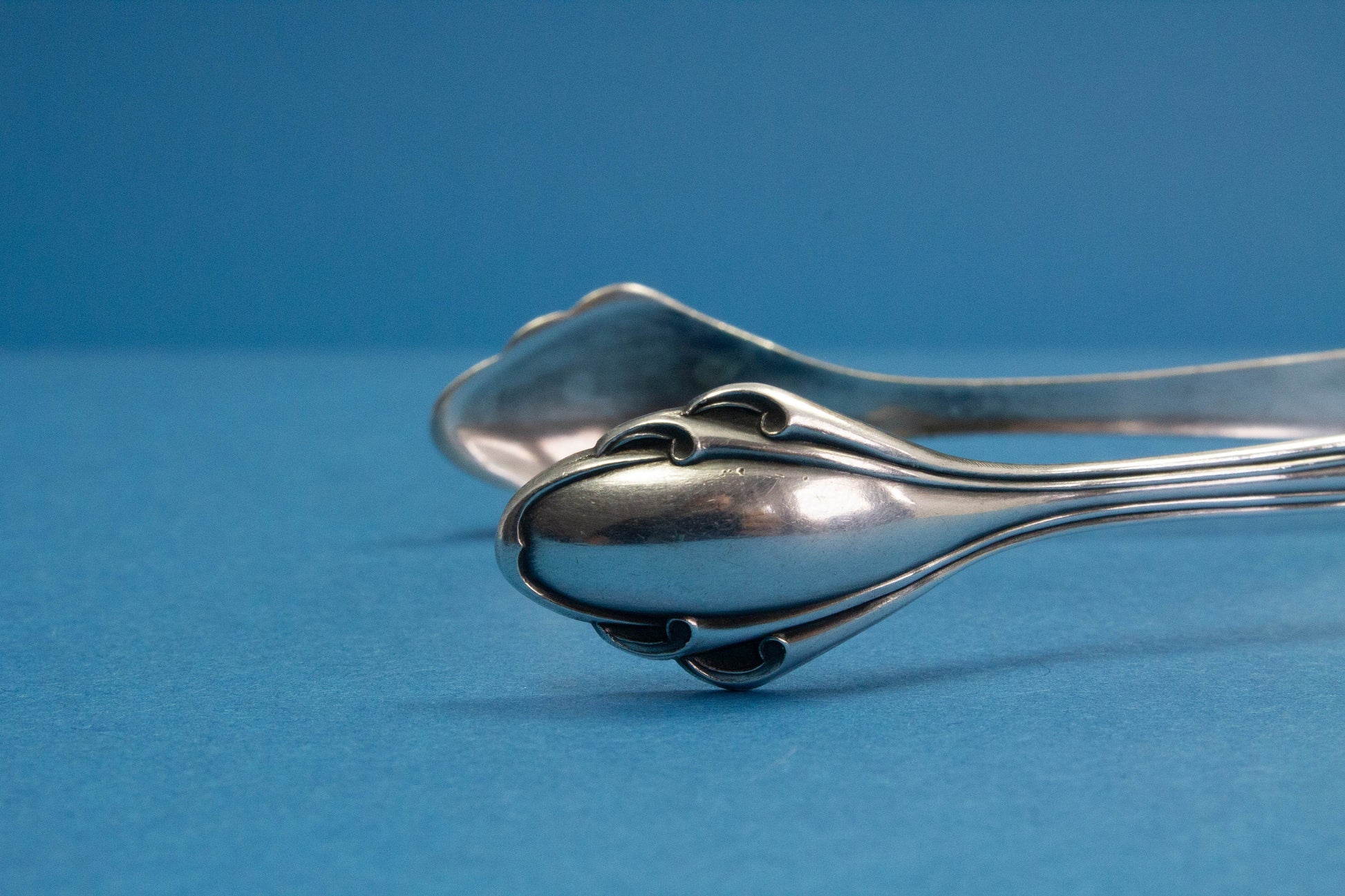 Silver plated sugar tongs with art nouveau pattern